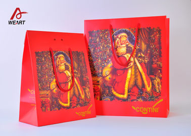 China Bolsas de papel lindas de gama alta de la Navidad del color rojo con la laminación del mate de las manijas proveedor